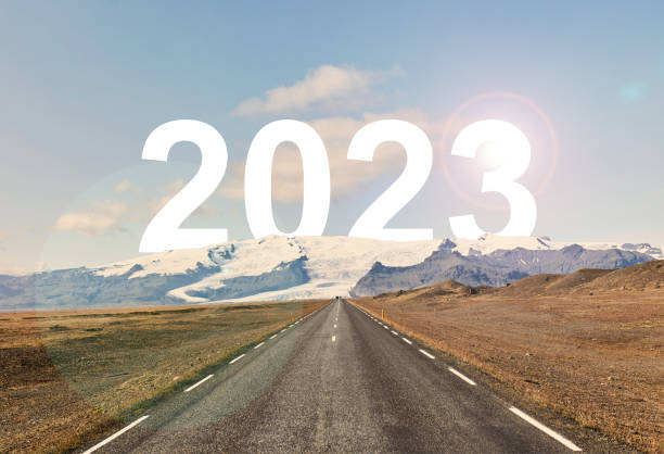 istock The word 2023 is written behind a glacier and an empty asphalt road 1437677282