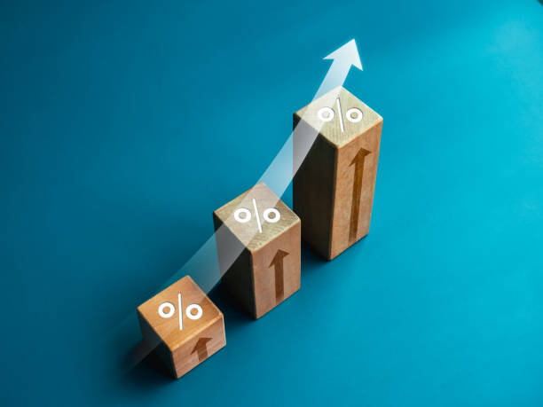 istock Shining rise up arrow with percentage icon on wooden blocks, 3d bar graph chart steps on blue background, business growth process, profit, market grow, leader trends, economic improvement concepts. 1437678652
