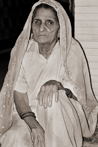 Close-Up portrait of old Indian women sitting at home.