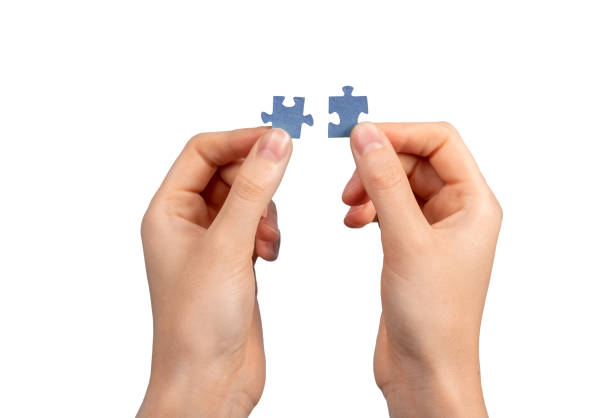 istock Hands connecting two puzzle pieces. Network, connection concept, isolated on white 1437691702