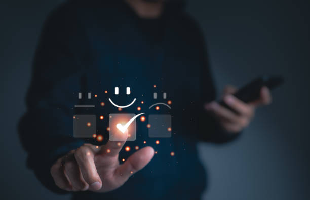 istock Man touching smile happy face emoticon on virtual touch screen. best rating positive, Customer service evaluation concept. quality review, feedback survey, marketing business, satisfaction user. 1437691707