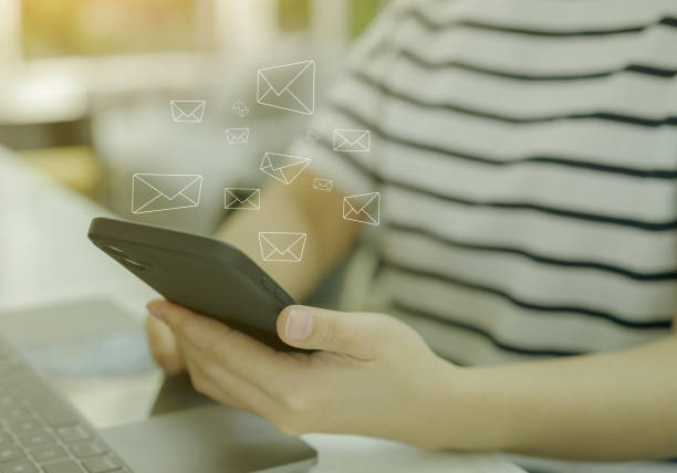 istock Woman using smart phone with email icon to send or read email work from home. Communication business technology concept. connection message to global letters. receive newsletter, 1437691855