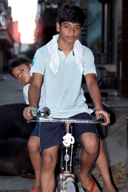 istock Indian teenage riding cycle 1437694196