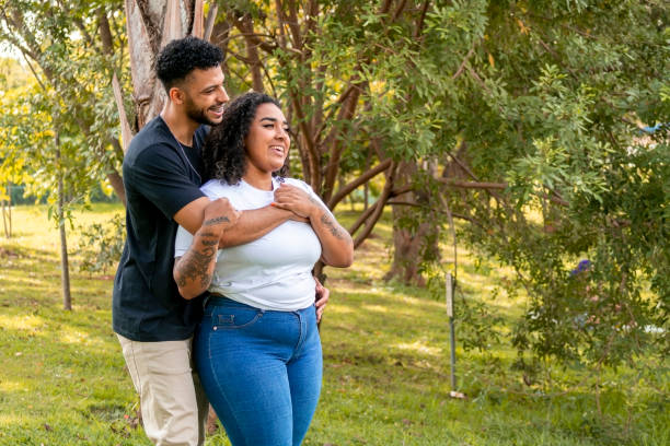 istock Young couple in a public park 1437694238