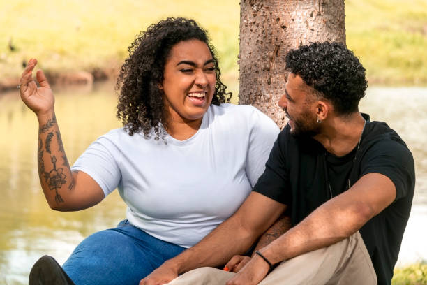 istock Young couple in a public park 1437694263