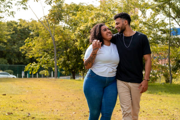 istock Young couple in a public park 1437694289
