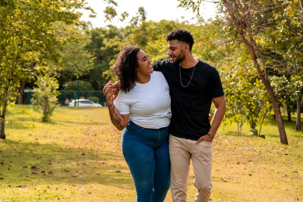 istock Young couple in a public park 1437694290