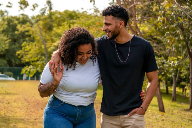 istock Young couple in a public park 1437694317