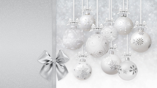 Merry Christmas decorative balls with silver shiny ribbons bows and glitter patterns, hanging on white background of blurred lights and snow. Gift greeting card ticket or promotional banner template.