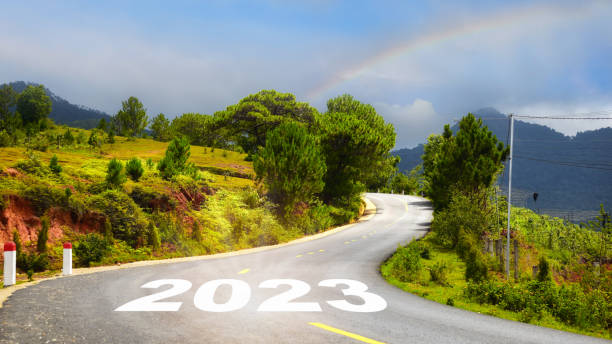 istock Journey to new year 2023 on asphalt road surface 1437700625