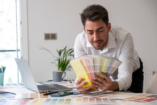 istock Designer man holding color cards 1437703061