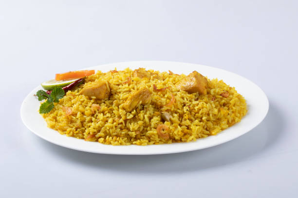 istock motton dhum biriyani using jeera rice and spices arranged in earthen ware with raitha and lemon pickle on grey background. 1437704714