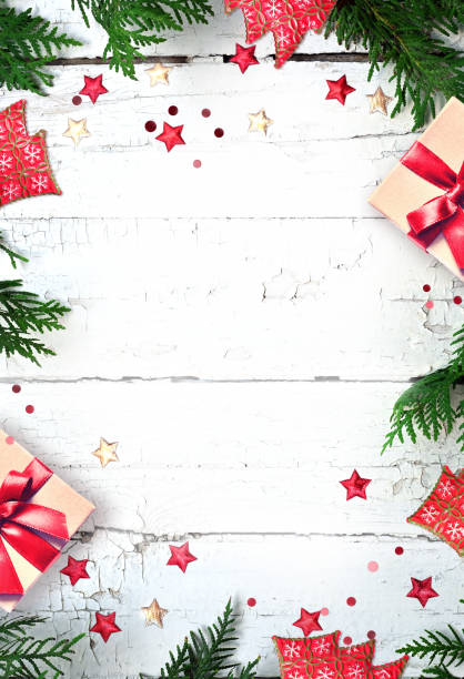 istock Christmas composition. Gift box, pine, fir branches on wooden white background. Flat lay, top view, copy space 1437705335