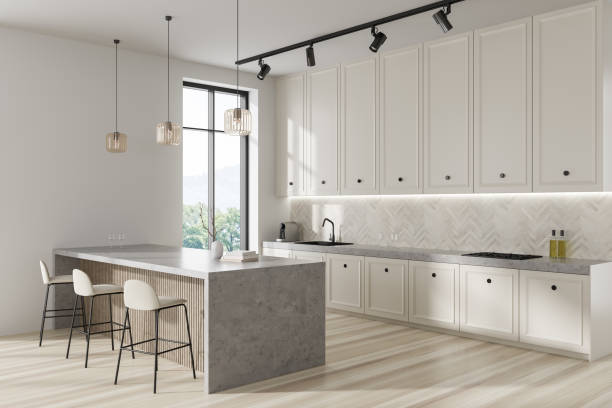 istock Light kitchen interior with bar island and seats, shelves and panoramic window 1437707801
