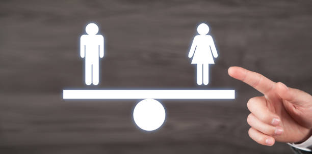 istock Man showing balance scale. Man and Woman 1437709659