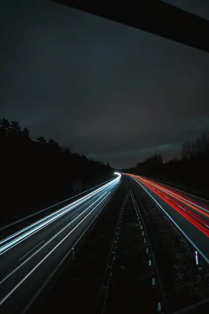 A view of light trails on the road on a gloomy night