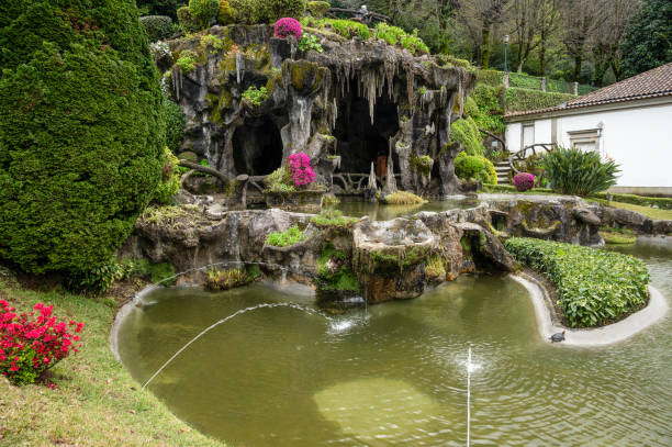 Grotto at the Sanctuary of Bom Jesus do Monte in Northern Portugal The Grotto or cave with natural plantings and water features at The Sanctuary of Bom Jesus do Monte in Northern Portugal. braga portugal stock pictures, royalty-free photos & images