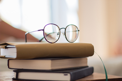 Books and glasses isolated on white background