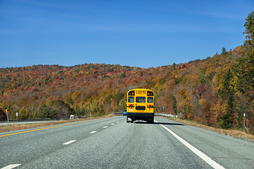 School bus driving north on I-89, New Hampshire, USA