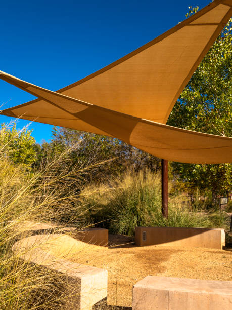 istock Triangle sun shade in the public park 1437714649