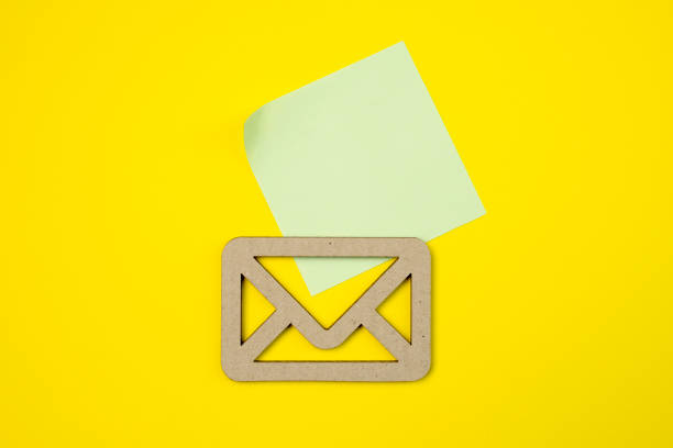 istock Envelope and email symbol on a yellow background. Concept email address. Internet technologies and contacts for communication. 1437715034