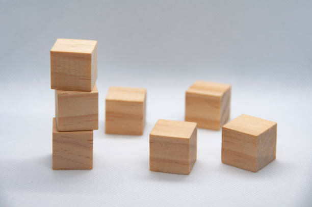 istock Blank wooden cubes on white background with customizable space for text or ideas. 1437715436