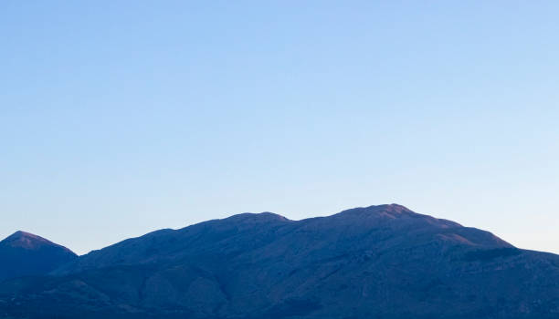 istock Scenic View Of Mountains Against Sky During Sunrise. 1437716310