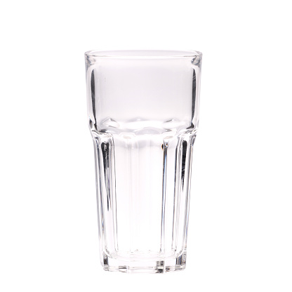 A vertical shot of a tall glass isolated on a white background