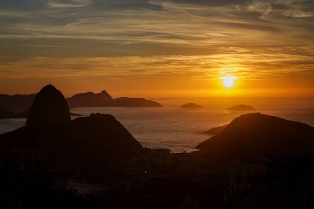 istock Beautiful sunset over a sea with hills 1437716973
