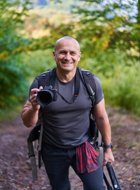 Nature photographer hiking in the forest