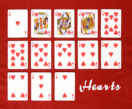 Queen of hearts playing card, isolated on white background.