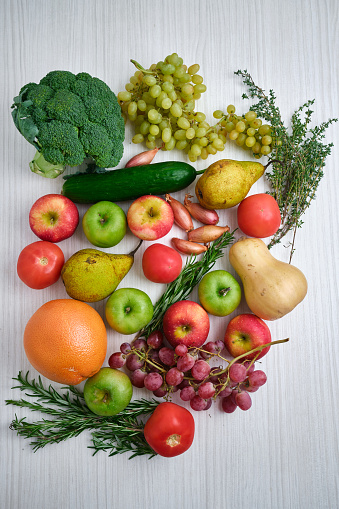Set of fresh vegetables and fruits on a light background. Vegetables close-up. Natural fresh organic vegetables. Healthy food, raw food diet. Vegetarian life. Proper nutrition. Ready to eat. Eco product