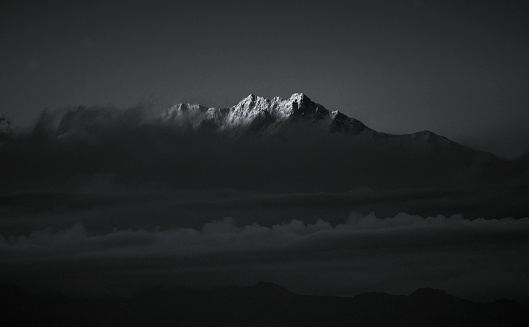 Ray of light on the peaks of of the majestic Kangchenjunga (also spelled Kanchenjunga and Khangchendzonga) range (third highest in the World) of Himalayas. The photo taken from Sandakphu, West Bengal.