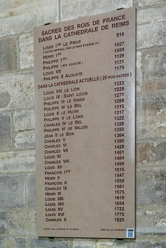 Reims, France- 13 September, 2022: wall plaque with the names of the French Kings anointed and crowned in the Rheims Cathedral
