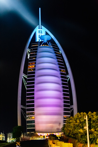 Dubai, UAE - March 13, 2018: Burj Al Arab Jumeirah lit up at night