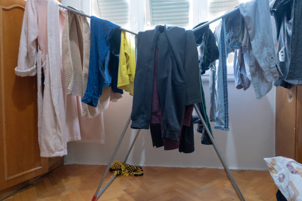 istock hanging clothes on laundry clothesline in living room 1437732637