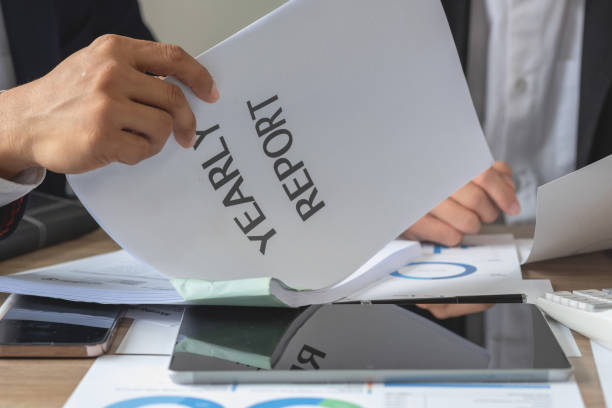 istock Team of business use calculators and graph analysis computer laptop tablets to plan marketing strategies and make profitable investments for the company. 1437734368