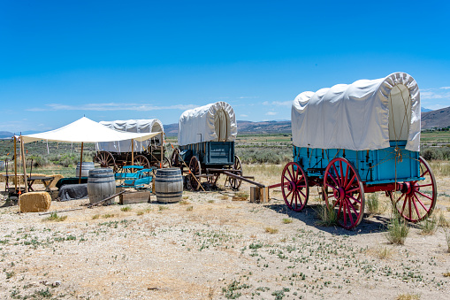 A pioneer wagon train encampment is depicted at the California Trail Interpretive Center. The museum presents the history of western US expansion in the 1800's. It is located on Interstate 80 near the original wagon train route of the California trail. \nElko, Nevada, USA\n06/30/2022