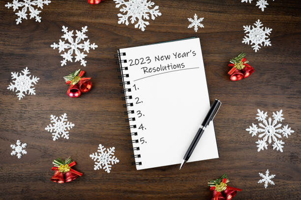 2023 new year's resolution text on note pad - determination new years eve list aspirations imagens e fotografias de stock