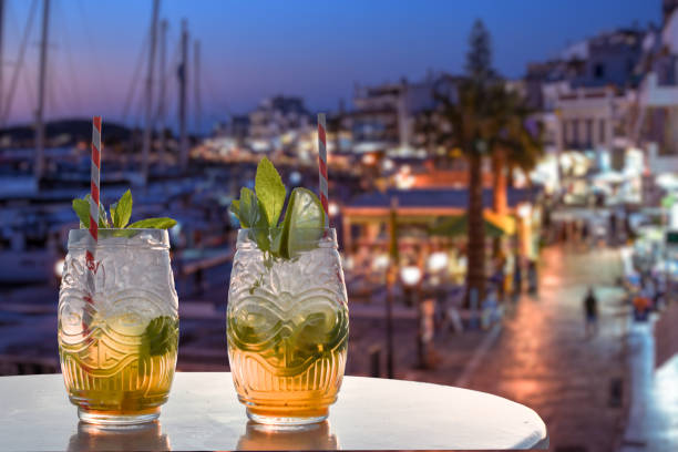 two drinks in front of a mediterranean harbor two drinks in front of a mediterranean harbor goa beach party stock pictures, royalty-free photos & images
