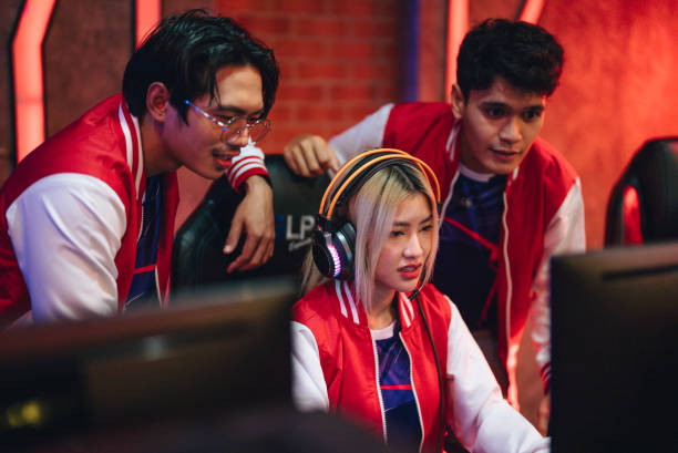 istock Team professional gamer playing winning tournaments online games computer. 1437737749