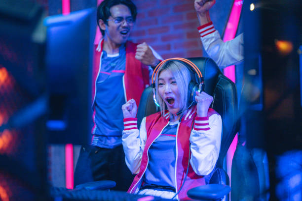 istock Pro gamers play in computer video game and win championship. 1437737770