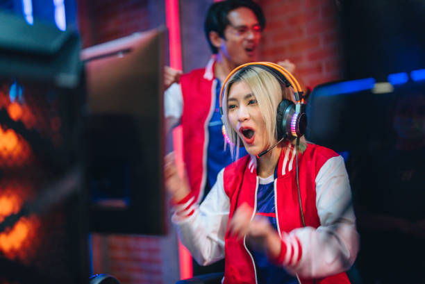 istock Team professional gamer playing winning tournaments online games computer. 1437737772