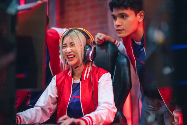 istock Team professional gamer playing winning tournaments online games computer. 1437737786