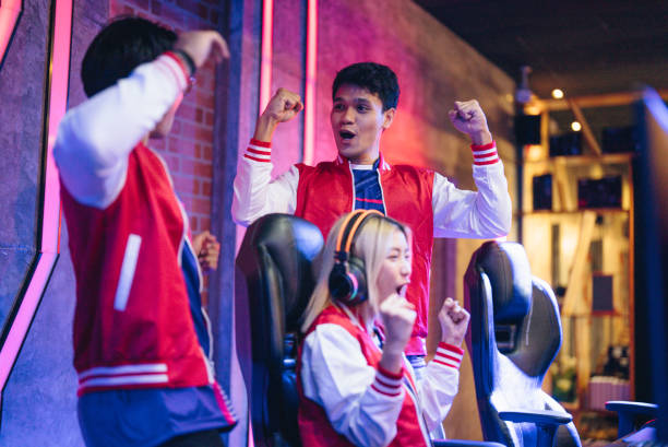 istock Team professional gamer playing winning tournaments online games computer. 1437737805