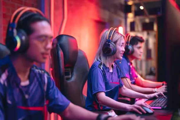 Photo of Asian eSports team competing in an eSports tournament.