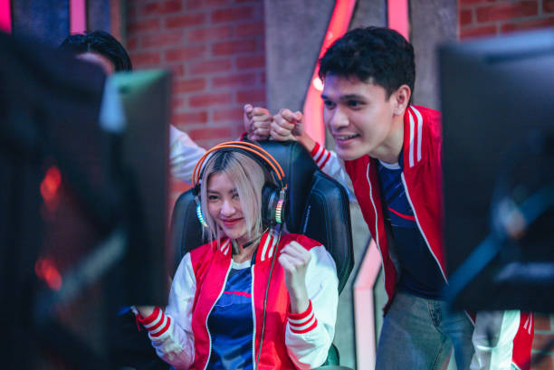 istock Pro gamers play in computer video game and win championship. 1437738442
