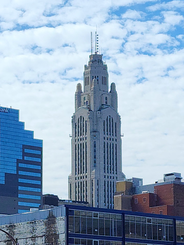 LeVeque Tower and surrounding buildings - Downtown - Columbus, Ohio, USA - with blue sky and puffy clouds