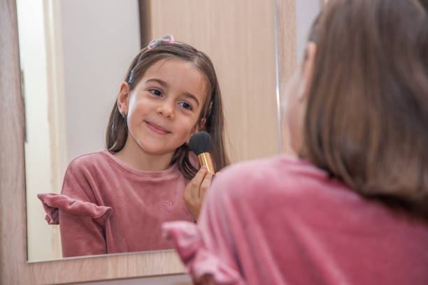 istock A little girl is doing makeup 1437739778
