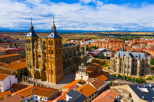 View from drone of residential area of Spanish city of Astorga overlooking medieval Gothic Cathedral and Episcopal Palace